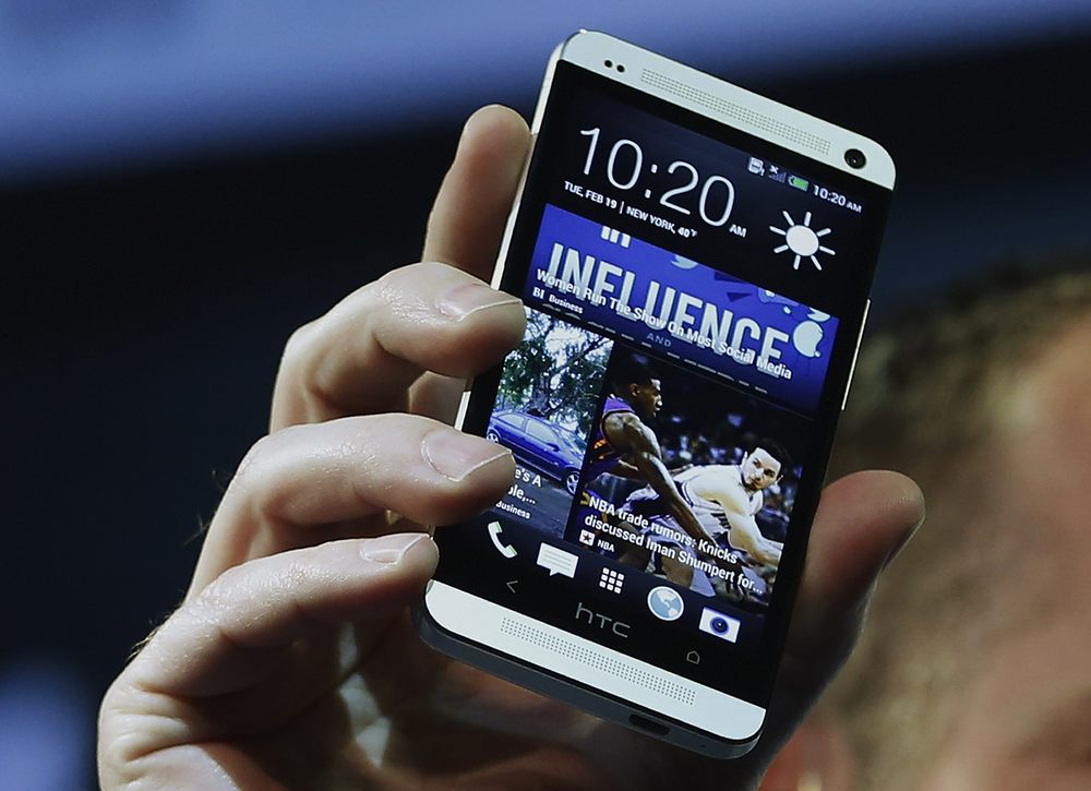 HTC president Jason Mackenzie shows the new HTC One during a launch event in New York